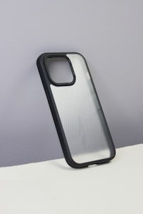 A sleek, modern 3D printed phone case with a geometric pattern in matte black.