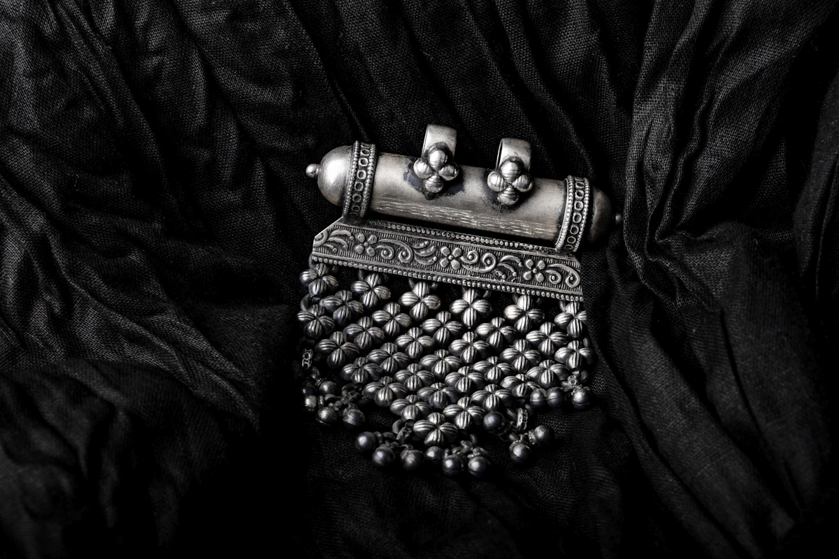 Sterling silver jewellery collection featuring handmade pendants and earrings