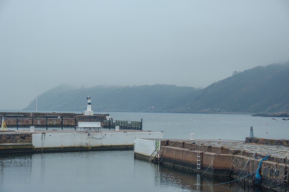 a harbor with a light house in the distance