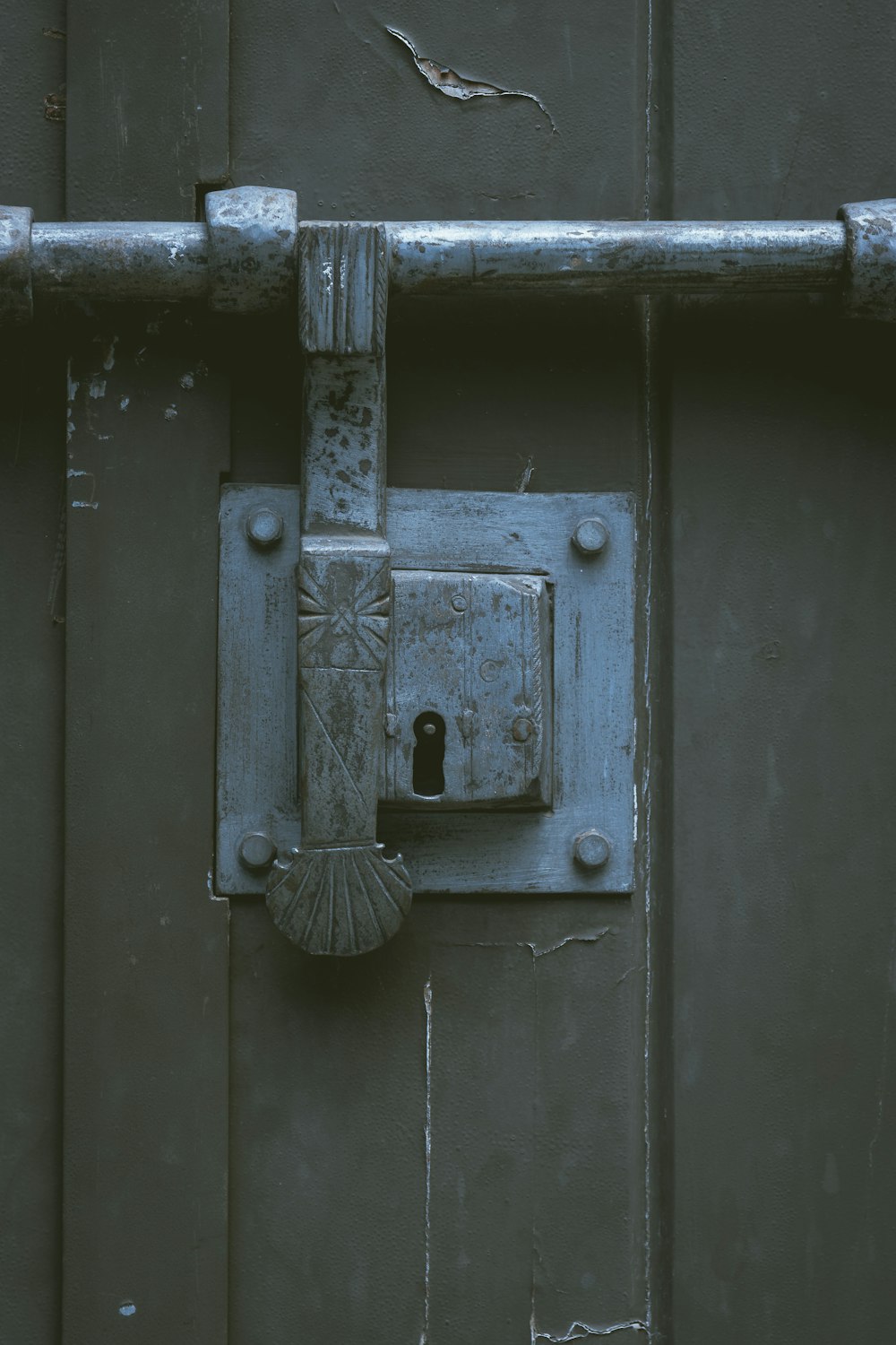 a metal door with a lock on it