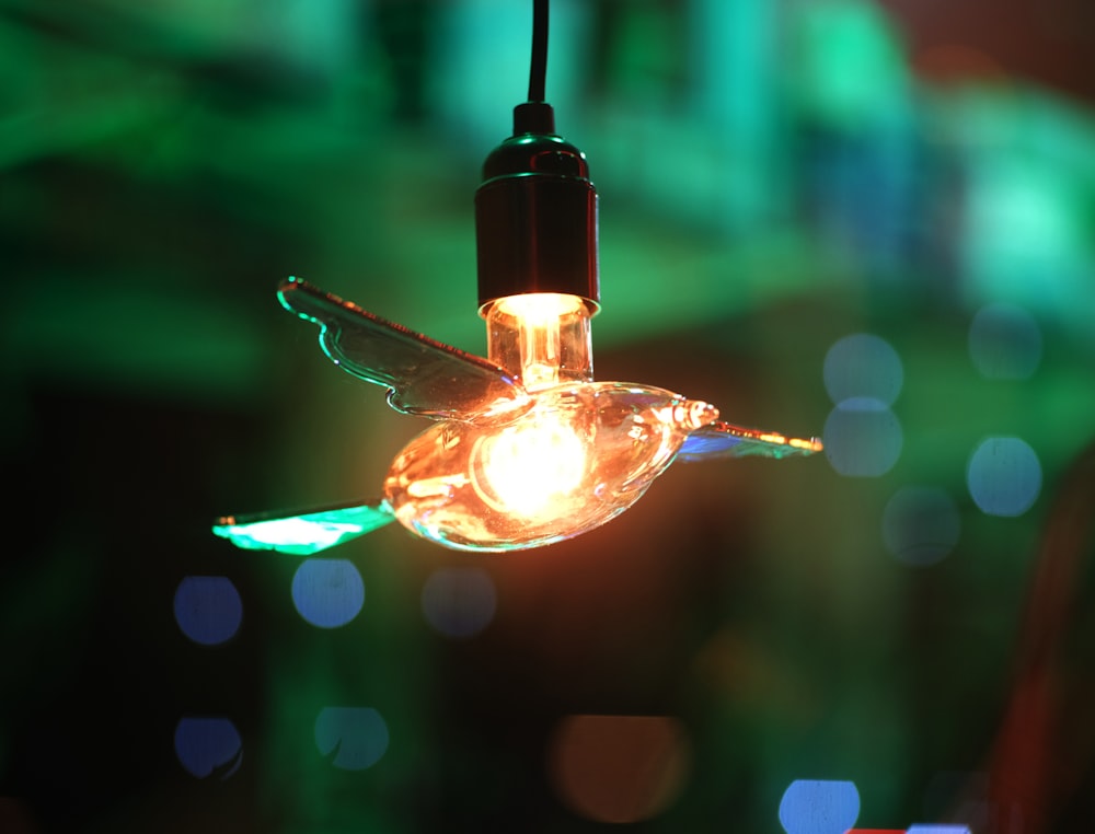 a close up of a light bulb hanging from a ceiling