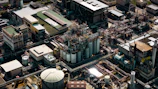 Aerial view of a sprawling mega project featuring intricate steel pipe networks and wire mesh installations.