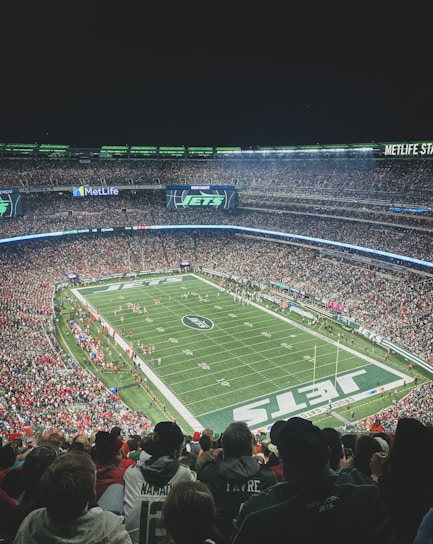 a stadium full of people watching a football game