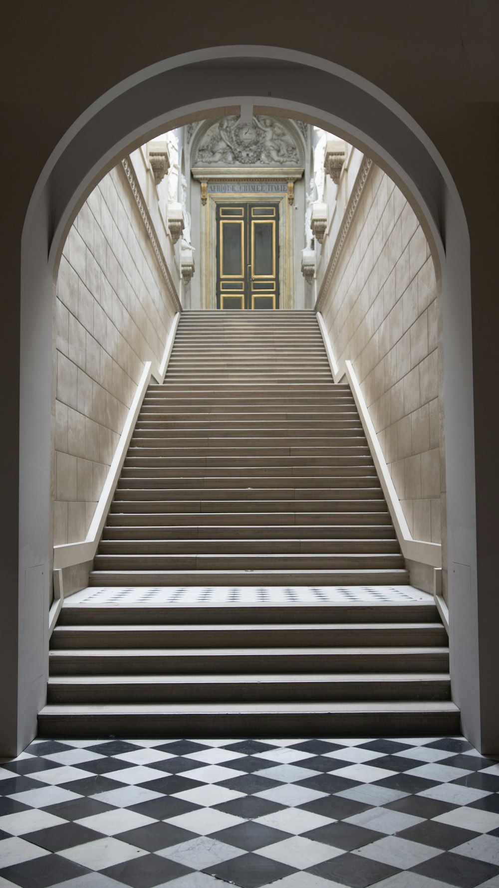 a set of stairs leading up to a yellow door