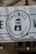 A banner displaying a logo with the text 'THE WELL' and an image of a water well with a droplet. The banner indicates the establishment has been serving Sheffield since 2015. It is mounted on a stone building and features decorative light bulbs hanging in front of it.