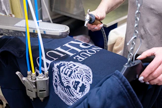a man holding onto a piece of luggage