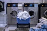 a laundry room with a washing machine and a laundry basket