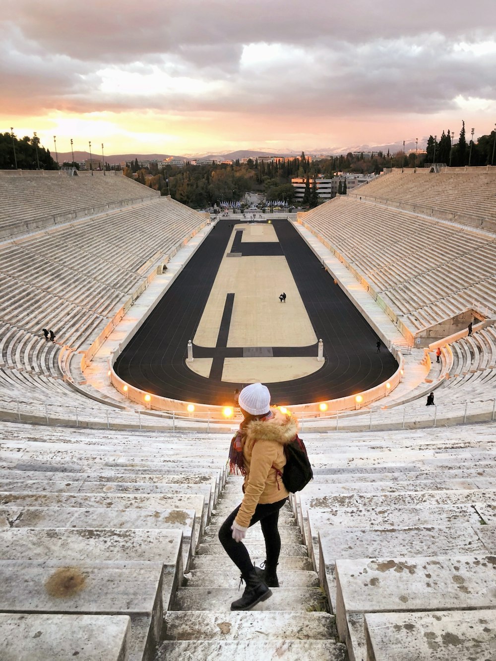 a person with a backpack standing on some steps