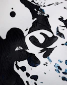 A collection of ink-inspired abstract shapes arranged artfully on a dark background.