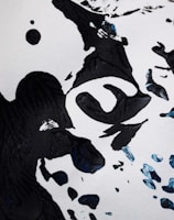 A surreal black ink piece featuring abstract symbols against a warm retro 80s background.