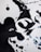 Abstract black ink shapes on a white background, with a few splashes of blue ink scattered around. The arrangement of the ink suggests a modern art piece with fluid forms and bold contrasts.