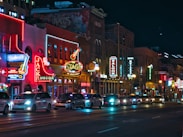a city street filled with lots of traffic at night