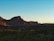 A serene Sedona red rock landscape at sunset, evoking calm and transformation.