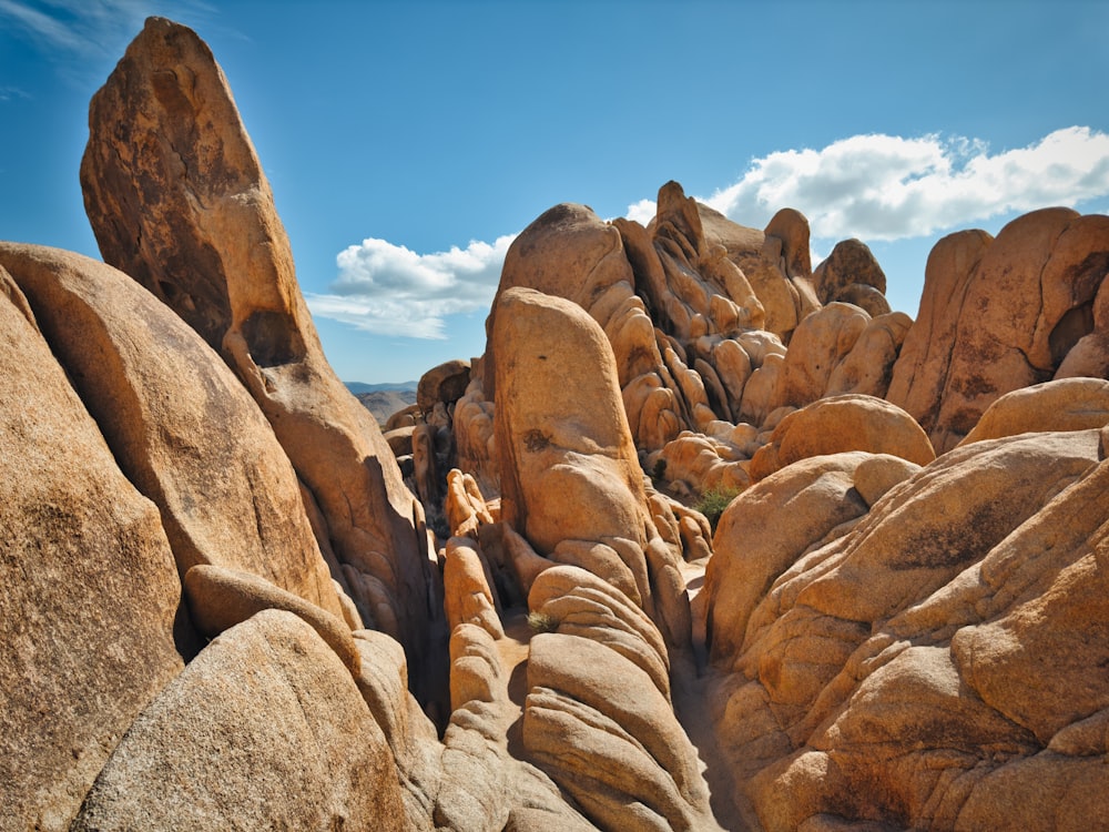 a person standing on top of a large rock formation