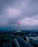 Wide view of an urban wireless hotspot tower glowing at dusk.