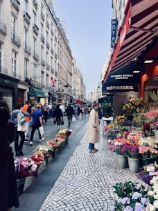 A bustling high street with small businesses and shoppers engaging warmly.