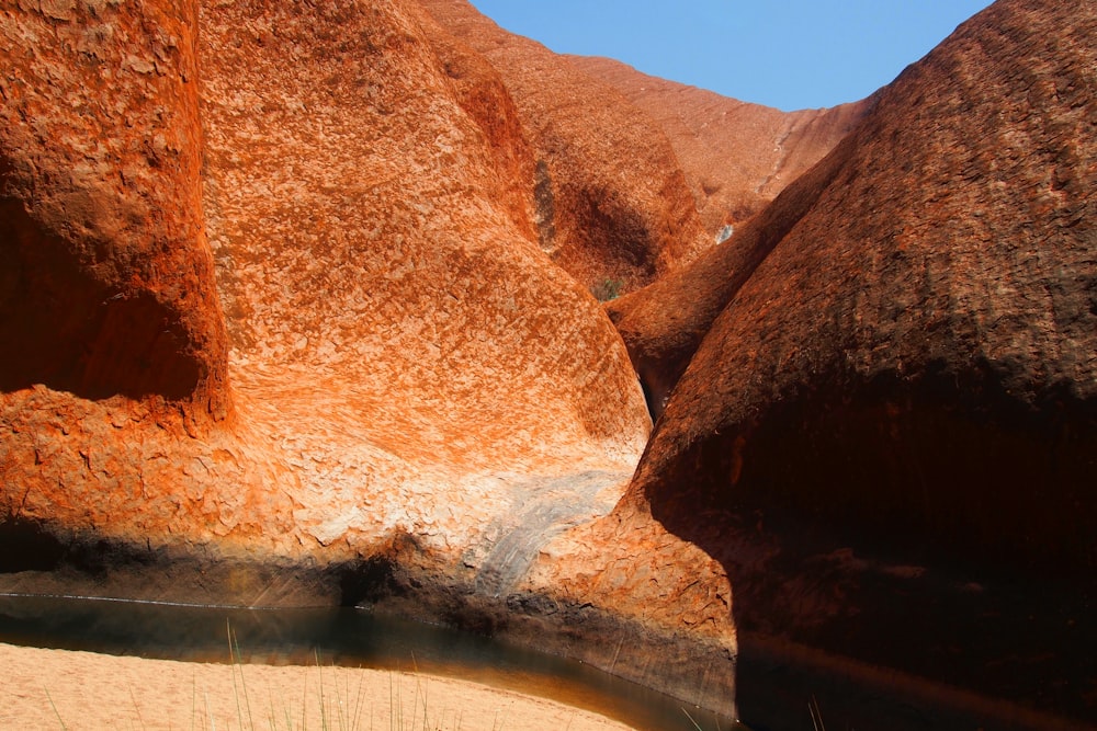 a body of water in between two large rocks