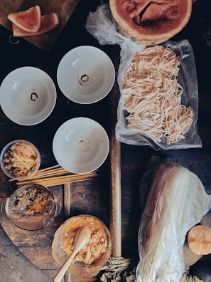 Fresh ingredients laid out on a rustic wooden table ready for cooking