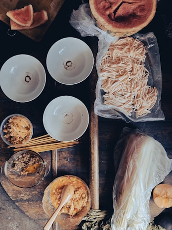 Fresh ingredients laid out on a rustic wooden table ready for the next cooking session.