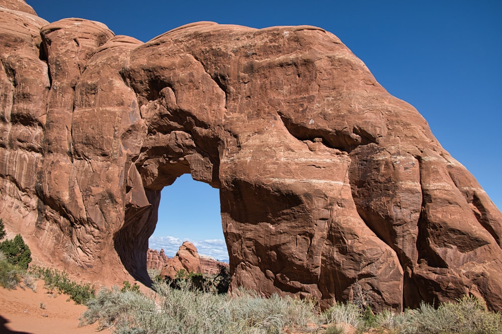 a large rock formation with a hole in the middle of it