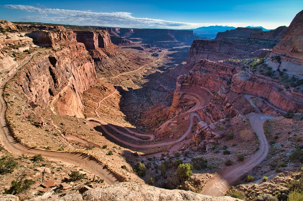 a scenic view of a canyon with a winding road