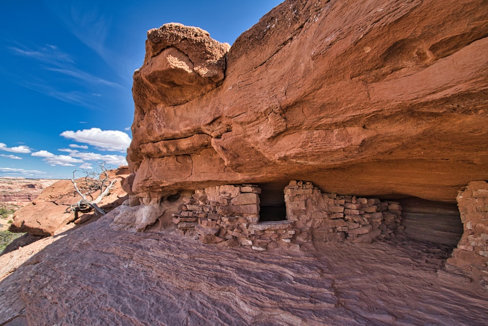 a rock house built into the side of a cliff