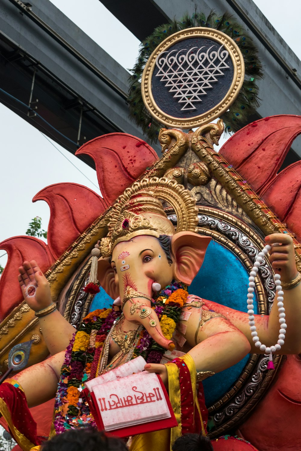 a statue of an elephant with a person in it's lap