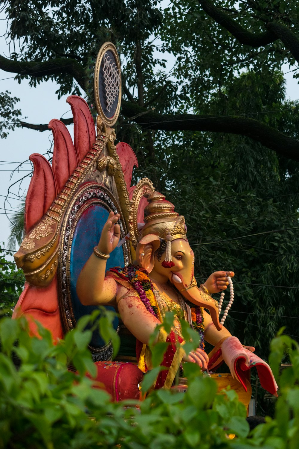 a statue of an elephant with a human face