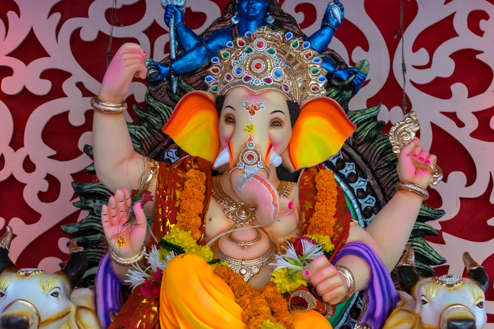 a statue of an elephant with a colorful head