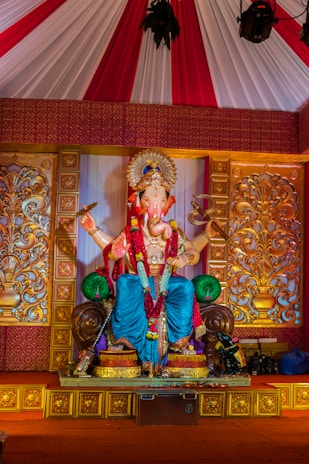 A richly decorated singhasan with traditional motifs and vibrant colors.