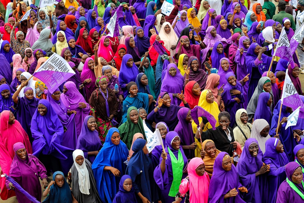 a large group of people dressed in brightly colored clothing