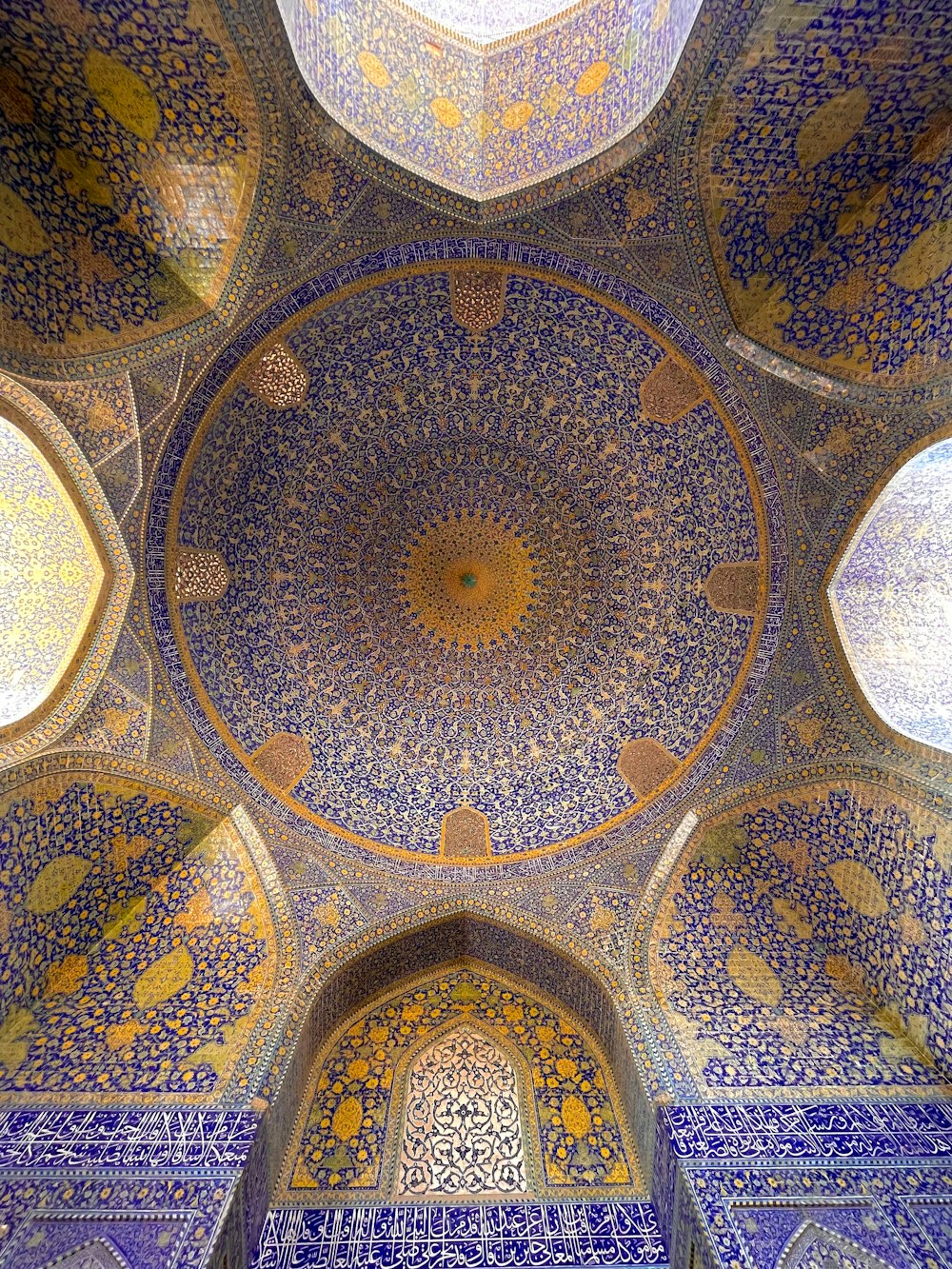 the ceiling of a building with blue and yellow tiles