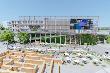 A corporate event setup with storytelling elements and interactive game stations.