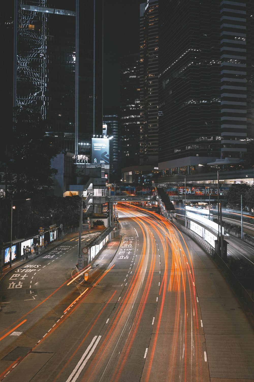 a city street filled with lots of traffic at night