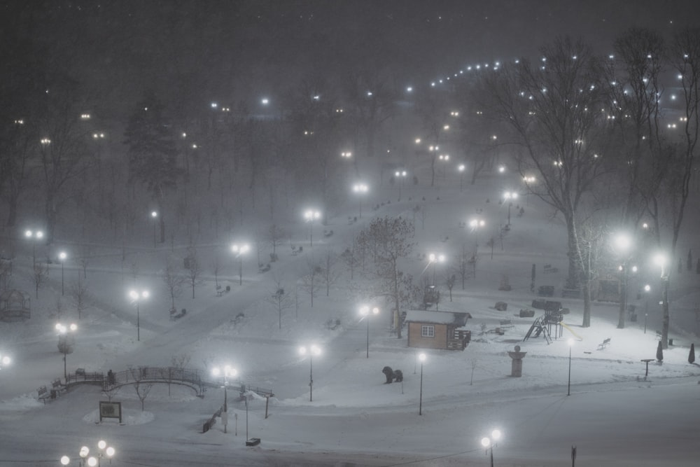 a ski slope covered in lots of snow at night