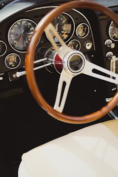 A beautifully restored dashboard featuring authentic wooden trims and new upholstery.
