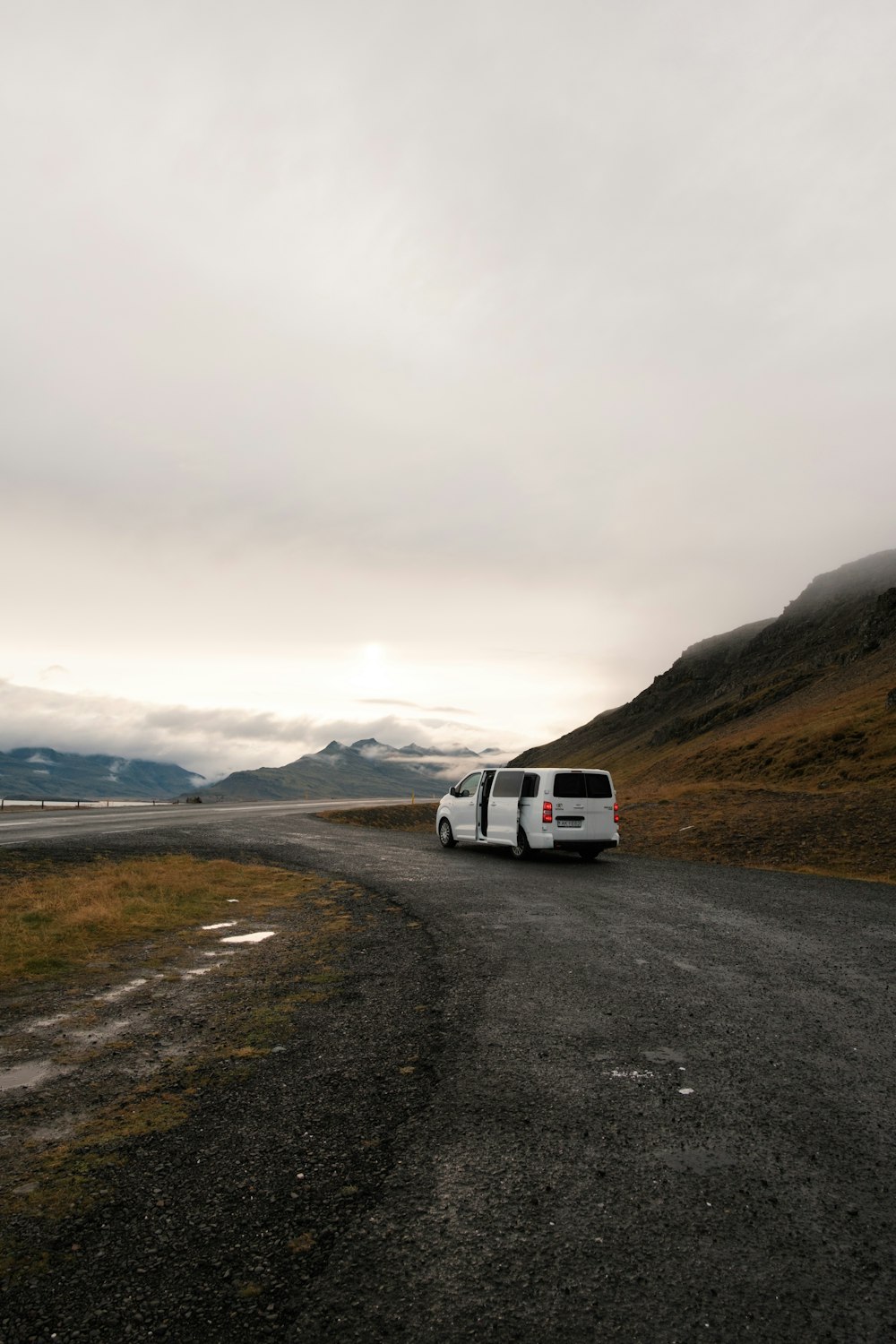 a white van parked on the side of a road