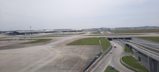 Wide shot of the Maranhão airport runway with Aeroisa vehicles in action.
