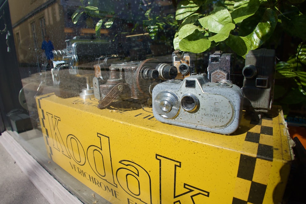 a display of old cameras in a store window