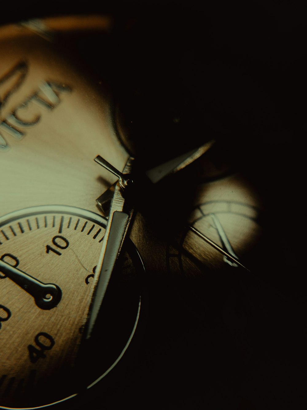 a close up of a pocket watch on a table