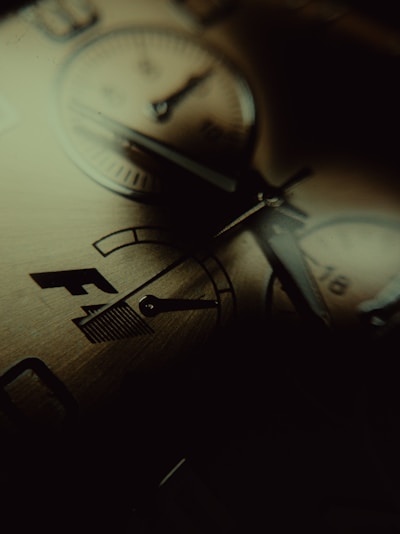 Close-up of the mother-of-pearl dial shimmering softly under warm light.