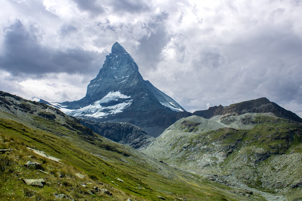 a mountain with a snow capped peak in the distance