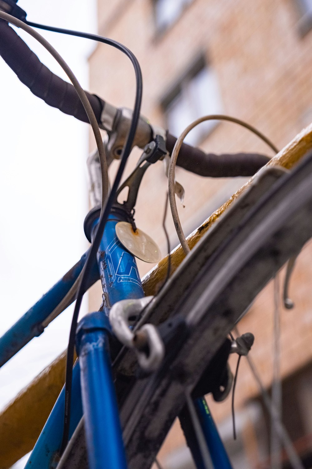 a close up of a bicycle with a building in the background