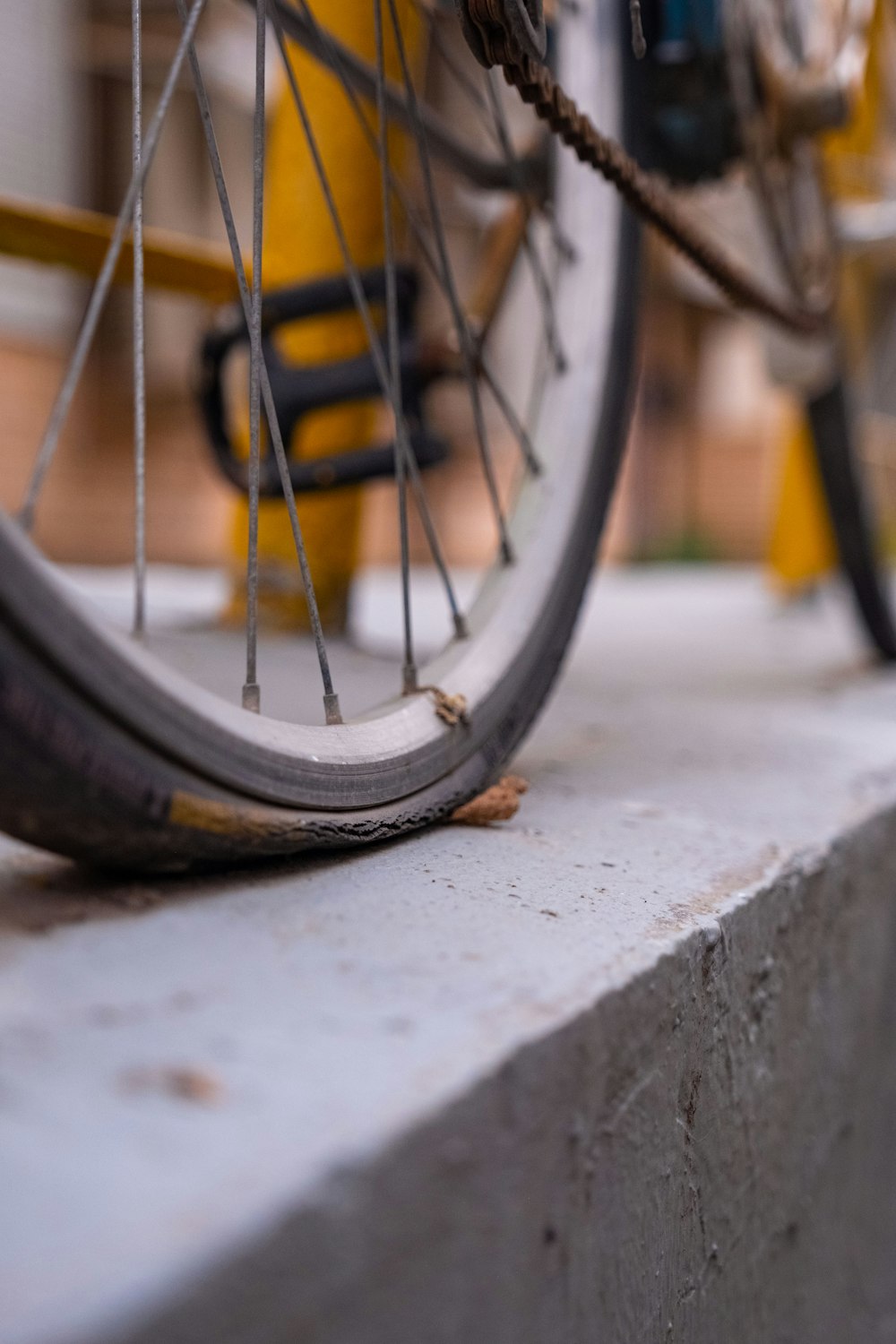 a close up of a bike tire on a concrete slab