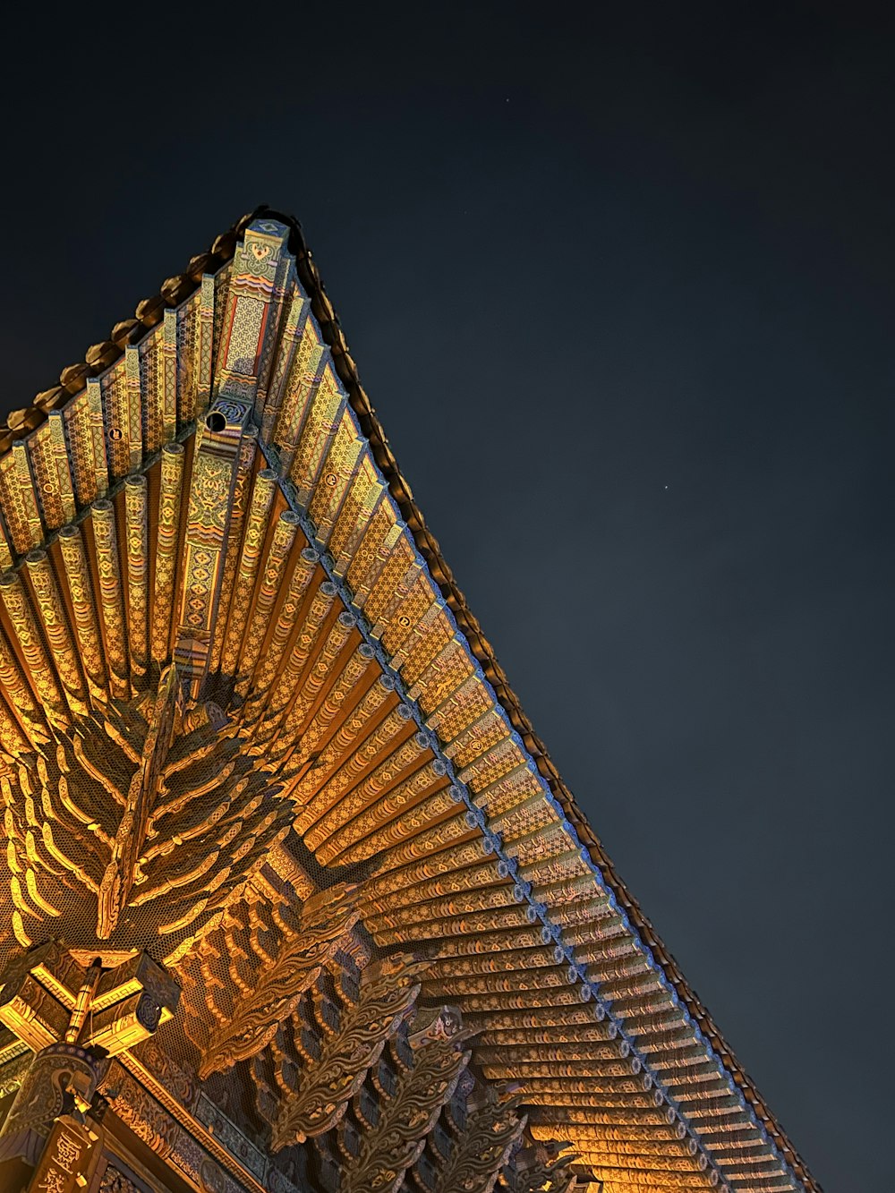 the top of a building lit up at night