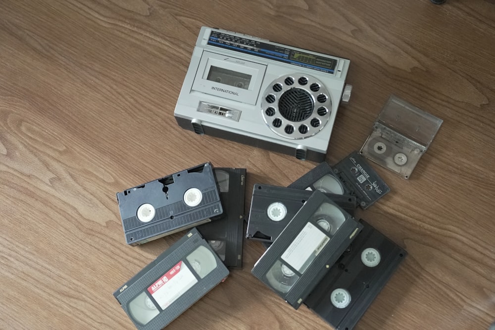 a group of cassettes sitting on top of a wooden floor