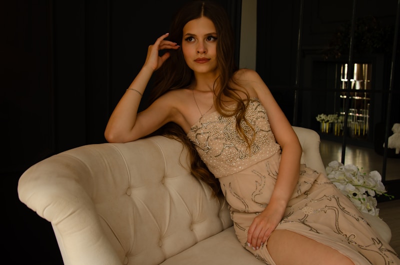 Graceful MILF in dress on couch