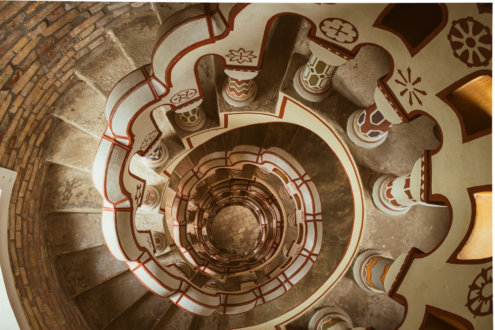 a spiral staircase in a brick building