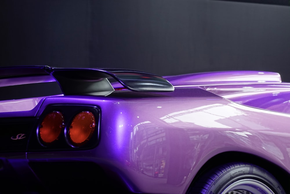 a close up of a purple sports car