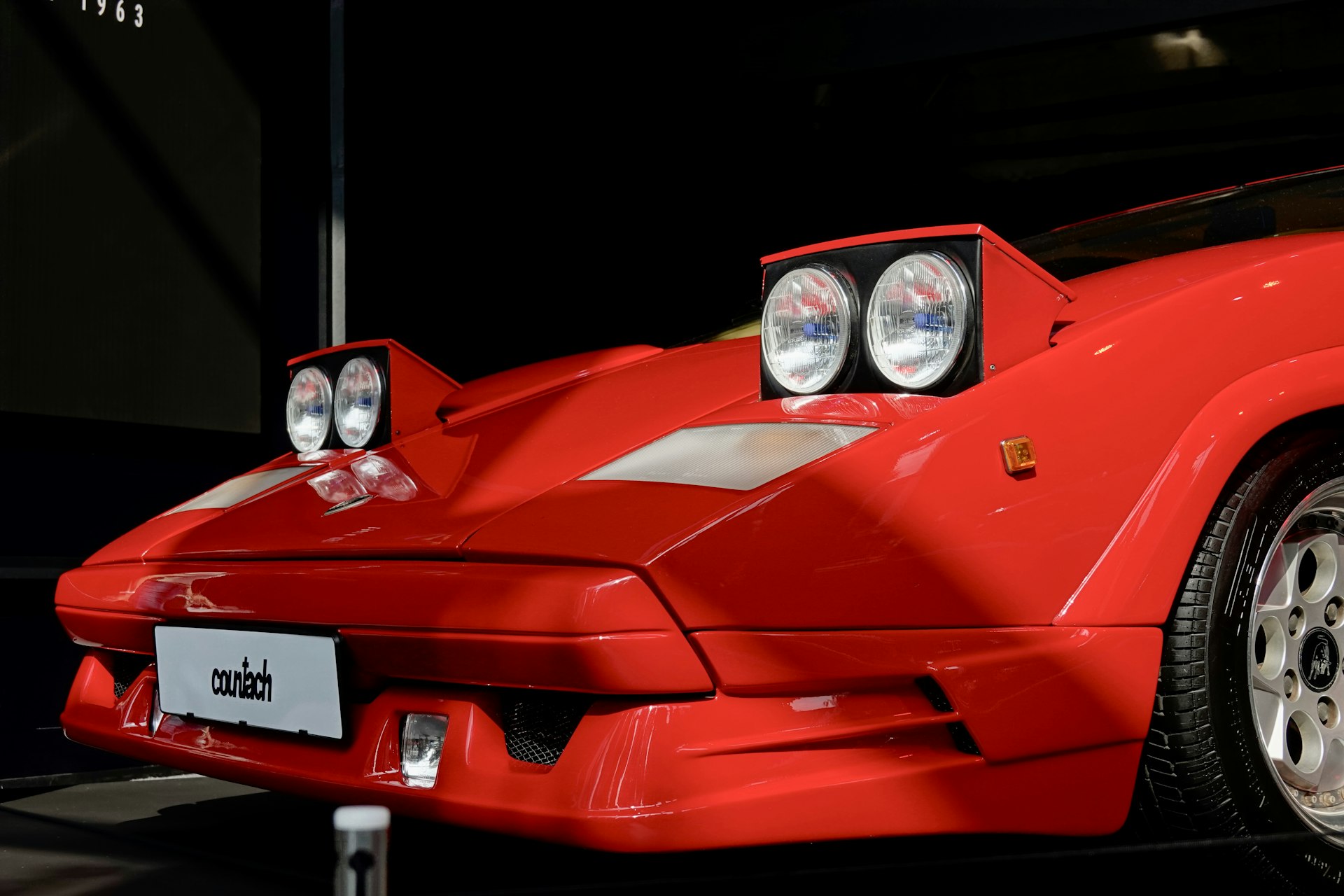 a red sports car parked in a garage